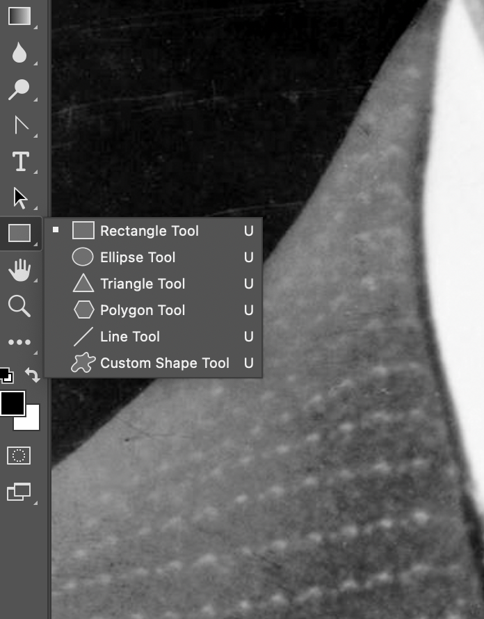 Selecting the Rectangle Tool from the toolbar.